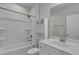 Clean, white bathroom with tub/shower combination and vanity at 233 Stone River Dr, Wendell, NC 27591