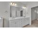 Bright bathroom with dual vanity and stylish lighting at 233 Stone River Dr, Wendell, NC 27591