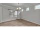 Bright dining area with hardwood floors, crown molding, and natural light at 233 Stone River Dr, Wendell, NC 27591