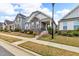 Inviting home showcasing stone detailing, a well-manicured front yard, and a welcoming entrance at 233 Stone River Dr, Wendell, NC 27591