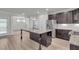 Gourmet kitchen featuring stainless steel appliances, granite counters, and a center island at 233 Stone River Dr, Wendell, NC 27591