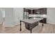 Modern kitchen featuring stainless steel appliances, granite countertop island, and ample storage at 233 Stone River Dr, Wendell, NC 27591