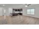 Open-concept living room and kitchen featuring hardwood floors and great natural light at 233 Stone River Dr, Wendell, NC 27591