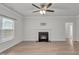Cozy living room featuring a fireplace and wood-look flooring at 233 Stone River Dr, Wendell, NC 27591