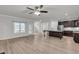 Open-concept living room and kitchen featuring hardwood floors and great natural light at 233 Stone River Dr, Wendell, NC 27591