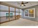 Screened porch with ceiling fan offers a relaxing outdoor space at 233 Stone River Dr, Wendell, NC 27591