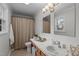 Bathroom with tile floors, single sink and shower/tub combo at 2629 Sweetgum Dr, Apex, NC 27539