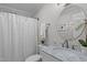 Bathroom with marble countertop, sink and shower/tub combo at 2629 Sweetgum Dr, Apex, NC 27539