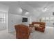 Cozy bonus room with plush seating, a television, and comfortable carpeting at 2629 Sweetgum Dr, Apex, NC 27539