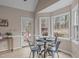 Bright breakfast nook with large windows and access to the outdoor deck at 2629 Sweetgum Dr, Apex, NC 27539