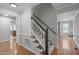 Spacious foyer with hardwood floors leading to stairs and adjoining rooms at 2629 Sweetgum Dr, Apex, NC 27539