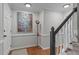 Bright entryway featuring hardwood floors, staircase, and stylish decor at 2629 Sweetgum Dr, Apex, NC 27539