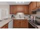 This eat-in kitchen has wood cabinets and stainless appliances at 2629 Sweetgum Dr, Apex, NC 27539