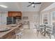 Eat in kitchen with modern appliances, breakfast bar, and adjacent breakfast nook with exterior access at 2629 Sweetgum Dr, Apex, NC 27539