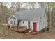 Charming home featuring a spacious deck, outdoor seating area, and well-maintained landscaping at 2629 Sweetgum Dr, Apex, NC 27539