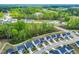 This aerial photo displays the community's beautiful green spaces and residential streets at 270 Trailing Bluff Way, Garner, NC 27529