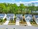 Aerial view of the neighborhood showing the homes with some trees and a clear blue sky at 270 Trailing Bluff Way, Garner, NC 27529