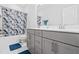 Bathroom featuring double sink vanity with modern fixtures and marble-style floor tiles at 270 Trailing Bluff Way, Garner, NC 27529