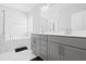 Bathroom with a modern double vanity, stylish fixtures, and a luxurious soaking tub at 270 Trailing Bluff Way, Garner, NC 27529