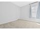 Bright bedroom with plush carpeting, neutral walls, and a window with sheer curtains at 270 Trailing Bluff Way, Garner, NC 27529