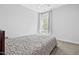 Comfortable bedroom with a ceiling fan and a large window with peaceful views at 270 Trailing Bluff Way, Garner, NC 27529