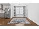 Bright dining area with hardwood floors, modern light fixture, and an elegant decorative rug at 270 Trailing Bluff Way, Garner, NC 27529