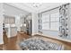 Dining space showcasing beautiful hardwood floors and open views to the modern kitchen at 270 Trailing Bluff Way, Garner, NC 27529