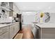 Open-concept kitchen with stainless steel appliances, modern cabinetry, and a central island at 270 Trailing Bluff Way, Garner, NC 27529
