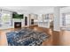 Open-concept living space with fireplace and view to the kitchen at 270 Trailing Bluff Way, Garner, NC 27529