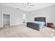 Main bedroom boasts a tray ceiling, a ceiling fan, and a spacious walk-in closet at 270 Trailing Bluff Way, Garner, NC 27529