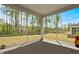 View of the screened porch with concrete flooring and a lovely view of the backyard and trees at 270 Trailing Bluff Way, Garner, NC 27529