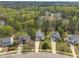 An aerial view of a residential street lined with well-maintained homes and mature trees at 2832 Steeple Run Dr, Wake Forest, NC 27587