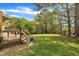 Large backyard with deck and grassy area at 2832 Steeple Run Dr, Wake Forest, NC 27587