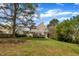 Backyard featuring an expansive lawn and a view of the back of the house at 2832 Steeple Run Dr, Wake Forest, NC 27587
