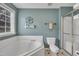 Bathroom featuring a soaking tub and walk-in shower at 2832 Steeple Run Dr, Wake Forest, NC 27587