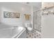 Bright bathroom with a soaking tub, separate shower, and patterned floors at 2832 Steeple Run Dr, Wake Forest, NC 27587