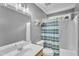Neutral bathroom featuring a white vanity, toilet, and a shower-tub combo with a striped curtain at 2832 Steeple Run Dr, Wake Forest, NC 27587