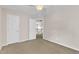 Cozy bedroom featuring carpet flooring, closet, and access to the hallway at 2832 Steeple Run Dr, Wake Forest, NC 27587