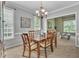 Elegant dining room with a classic chandelier and ample seating at 2832 Steeple Run Dr, Wake Forest, NC 27587