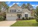 Well-maintained home with manicured lawn, attached garage, and tasteful landscaping, showcasing suburban charm at 2832 Steeple Run Dr, Wake Forest, NC 27587