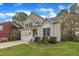View of a two-story home with an attached garage, manicured landscaping, and inviting curb appeal at 2832 Steeple Run Dr, Wake Forest, NC 27587