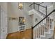 Bright foyer with high ceilings, hardwood floors, staircase, and decorative accents at 2832 Steeple Run Dr, Wake Forest, NC 27587