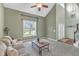 Bright living room with large windows, high ceilings, and comfortable seating at 2832 Steeple Run Dr, Wake Forest, NC 27587