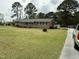Traditional brick house with a large yard, offering a serene and inviting curb appeal at 2886 Steven'S Chapel Rd, Smithfield, NC 27577