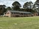 Well-kept brick home features a spacious lawn and classic design elements at 2886 Steven'S Chapel Rd, Smithfield, NC 27577