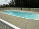 Inviting in-ground pool with a white fence, perfect for relaxation and recreation at 2886 Steven'S Chapel Rd, Smithfield, NC 27577