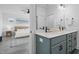 Bright bathroom with double sink vanity and a view into the light-filled bedroom at 304 Rivella Dr, Wake Forest, NC 27587