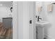 Modern bathroom featuring a stylish pedestal sink and contemporary fixtures at 304 Rivella Dr, Wake Forest, NC 27587