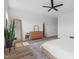 Spacious bedroom featuring a large mirror, fan and modern decor, bathed in natural light at 304 Rivella Dr, Wake Forest, NC 27587