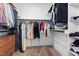 Spacious walk-in closet with ample hanging space, shelving and wood floors at 304 Rivella Dr, Wake Forest, NC 27587